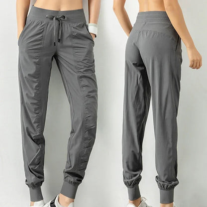 Pantalones deportivos de tela con cordón ajustable para correr