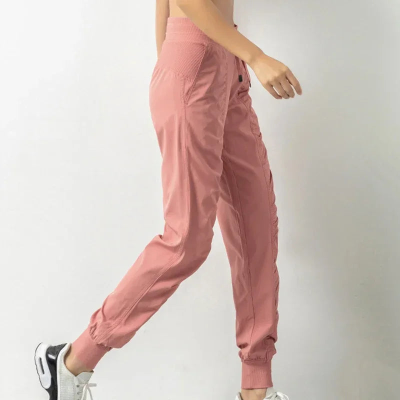 Pantalones deportivos de tela con cordón ajustable para correr