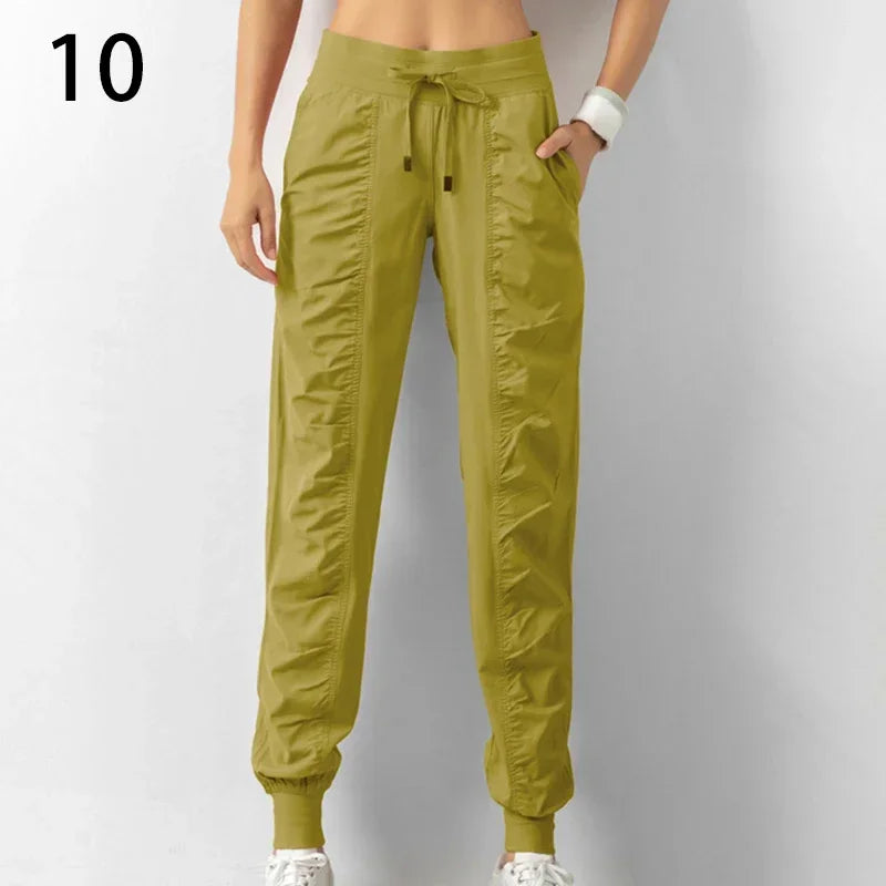 Pantalones deportivos de tela con cordón ajustable para correr