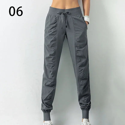 Pantalones deportivos de tela con cordón ajustable para correr