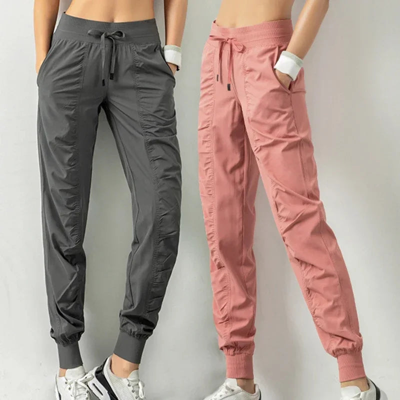 Pantalones deportivos de tela con cordón ajustable para correr