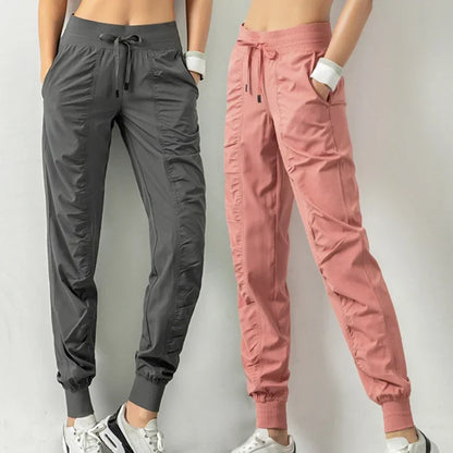Pantalones deportivos de tela con cordón ajustable para correr
