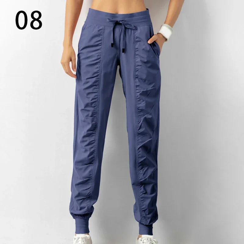 Pantalones deportivos de tela con cordón ajustable para correr