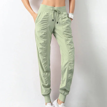 Pantalones deportivos de tela con cordón ajustable para correr