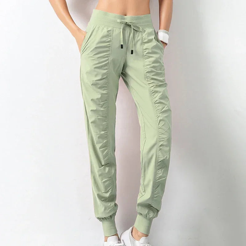 Pantalones deportivos de tela con cordón ajustable para correr