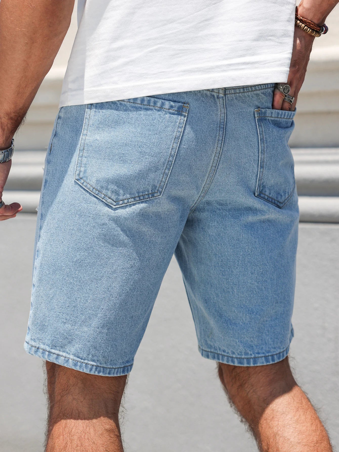 Pantalones cortos vaqueros de búfalo de agua lavados con agujeros