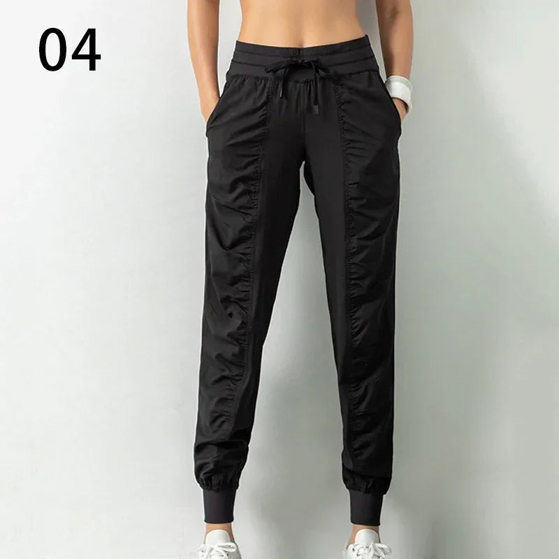 Pantalones deportivos de tela con cordón ajustable para correr