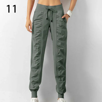 Pantalones deportivos de tela con cordón ajustable para correr