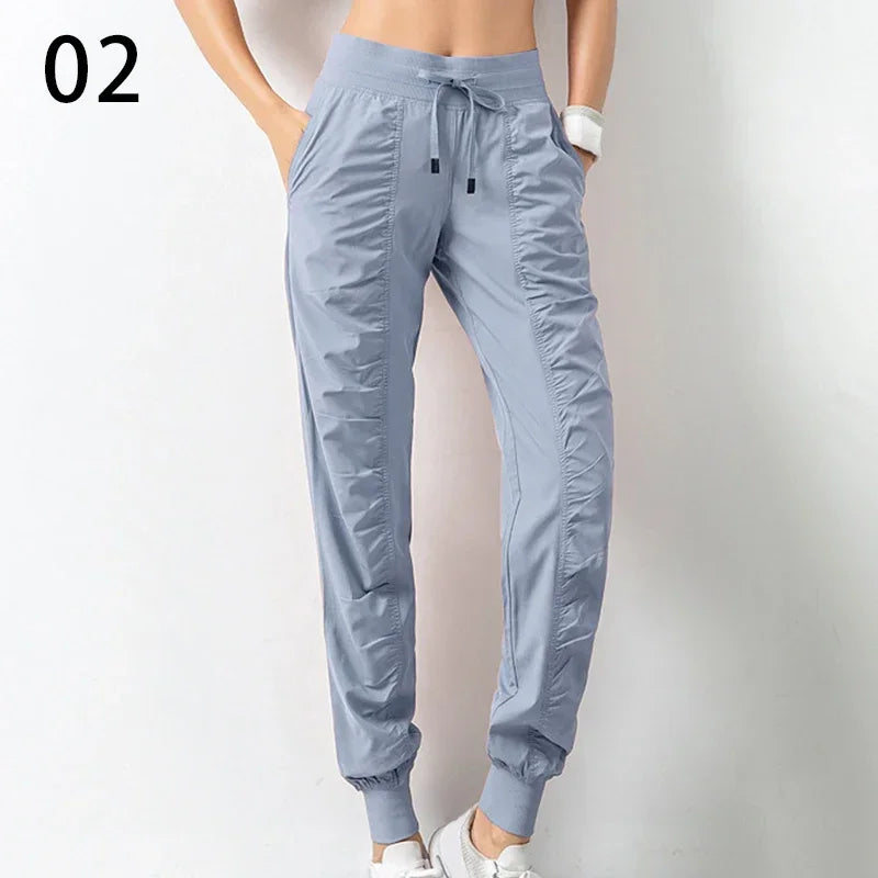 Pantalones deportivos de tela con cordón ajustable para correr