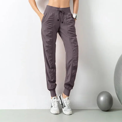 Pantalones deportivos de tela con cordón ajustable para correr