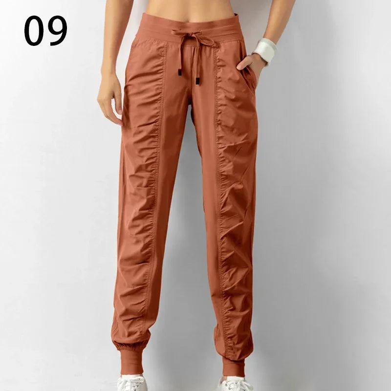 Pantalones deportivos de tela con cordón ajustable para correr