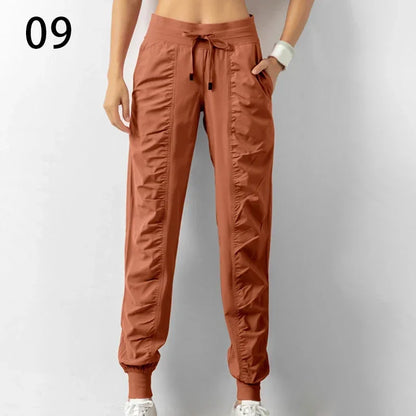 Pantalones deportivos de tela con cordón ajustable para correr